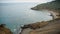 View of Azure Sea Stony Beach Waves Strike Rocks