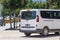 View of the back of the minibus, the door. Parking on a busy city street