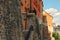 View of the back of the residential houses in Loket. Their walls use medieval stone fortifications