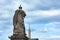 A view of the back of the sculpture of Saint Peter and obelisk at Saint Peter`s Square in the Vatican City in Rome, Italy