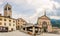 View at the Bajona Clock tower and Saints Gervasio and Protasio at Cavour place in Bormio, Italy