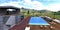 View from the balcony of a stylish private estate built on a mountain plateau to a recreation area in the courtyard of a house