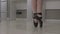View of a ballerina standing en pointe on the tips of her toes in a pair of ballet shoes