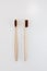 View of bamboo toothbrush front and side. Vertical orientation.