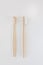 View of bamboo toothbrush front and side. Vertical orientation.