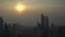 View of Bangkok city metropolis grey smog silhouette of buildings against sunset