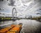 View of barge pulling yellow cointainers along River Thames.London