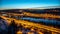 View of Barrandov Bridge over Vltava River in Branik, Prague, Czech Republic. Illuminated roads in cold winter evening