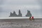 View of basalt stacks Reynisdrangar, black sand beach near Vik,