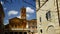 View of the Basilica of Santa Maria in Trastevere from the homonymous alley, on a sunny day with dry branches of trees blurred in