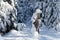 View of a Bavarian winter landscape with lots of snow, blue sky with clouds