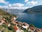 View of the Bay of Kotor over the red roofs of old houses. Perast, Montenegro. Drone
