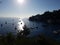 View of the bay of Paxos with yachts and the sun