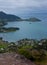 A view at the bay with the sea and family houses from the Mt. Manaia near Whangarei in the North Island on New Zealand