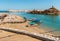 View of bay of Sur with Al Ayjah Lighthouse, forts on the rocks and traditional fish boats on the beach, Sultanate of Oman in the