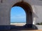 View of the beach through the arcade.