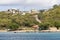 View of Beach, Boats, Jetty and Houses; Saline Bay, Mayreau Island, Saint Vincent and the Grenadines, Eastern Caribbean.