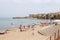 View of the beach of Cefalu with the old city in the background