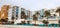 View of beach hotels and sun loungers along boardwalk in Treasure Island Florida