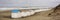 View on the beach huts on the west coast area of Texel. Panoramic view on the North Sea