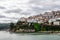 View from the beach of Lastres a village in the Cantabrian coast in Asturias Spain. White houses in a steep surface