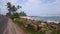 View of the beach, palm trees, coastline, road