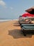 The view at the beach with resting armchairs at Goa