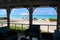 View of a beach and the sea through a mosquito net. Long Island, Bahamas