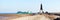 View of the beach with a ship and the Kugelbake in Cuxhaven, Germany