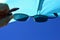 View on beach sun shield and blue skies through dioptric sunglasses with UV400 filter