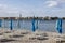 View from the beach with umbrellas of the city with the bell tower of the Basilica of Euphrasius, Porec, Croatia, Istria