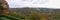 View from Beaumont Park in Huddersfield looking across to the Jubilee tower castle hill and the railway viaduct at Lockwood