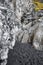 View of beautiful basalt columns at famous Reynisfjara Beach against cloudy sky