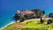 View of beautiful bay with beach and Dominican monastery in Bol town, Brac island, Croatia. Dominican monastery in Bol, built in