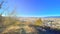 View of the beautiful city from a hill of coniferous forest.