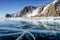 View of beautiful drawings on ice from cracks and bubbles of deep gas on surface of Baikal lake in winter, Russia