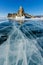 View of beautiful drawings on ice from cracks and bubbles of deep gas on surface of Baikal lake in winter, Russia