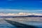 View of beautiful drawings on ice from cracks on surface of Khubsugul lake in winter with mountain, Mongolia