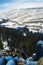 View of the beautiful mountain landscape through legs of touris