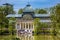 View of the beautiful Palacio de Cristal a conservatory located in El Retiro Park built in 1887 in