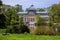 View of the beautiful Palacio de Cristal a conservatory located in El Retiro Park built in 1887 in