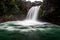 View on beautiful powerful waterfall where Lord of The Rings scene with Golum took place. Native flora surrounds scene. Tongariro