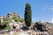 A view of a beautiful rocky landscape and a tree in the island of Patmos, Greece