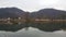 View of beautiful scene of river water and green trees on large hills