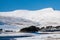 View of beautiful snow covered mountains on a crisp, winters day