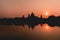 View of the beautiful sunset and its reflection in the water in Maidan, Kolkata, India