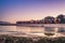 View of the beautiful sunset over False Bay from Kalkbay with little colorful houses, Cape Town