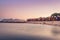 View of the beautiful sunset over False Bay from Kalkbay with little colorful houses, Cape Town