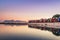 View of the beautiful sunset over False Bay from Kalkbay with little colorful houses, Cape Town