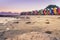 View of the beautiful sunset over False Bay from Kalkbay with little colorful houses, Cape Town